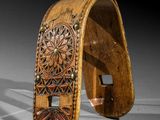 an image of a wooden bracelet with a carved design on it