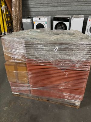 boxes of appliances are stacked on top of each other in a warehouse
