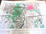a map on a table with a pink marker