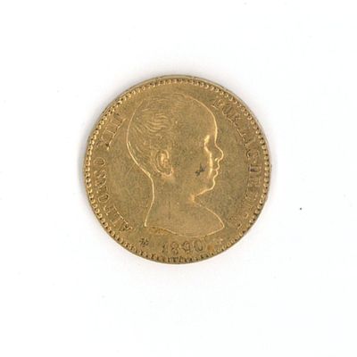 a close up of a gold coin with a child ' s face