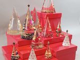 a lot of red boxes with christmas decorations on them