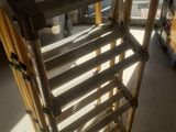 a wooden rack that is sitting in the middle of a room