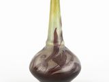 a vase that is sitting on a white surface