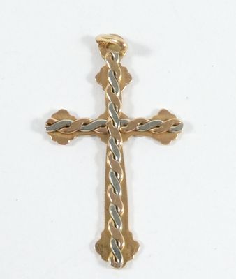 une croix qui se trouve sur une surface blanche
