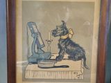 framed picture of a dog sitting on a table with a bottle of wine