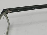 a pair of glasses sitting on a white surface