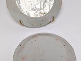 two plates that are sitting side by side on a table