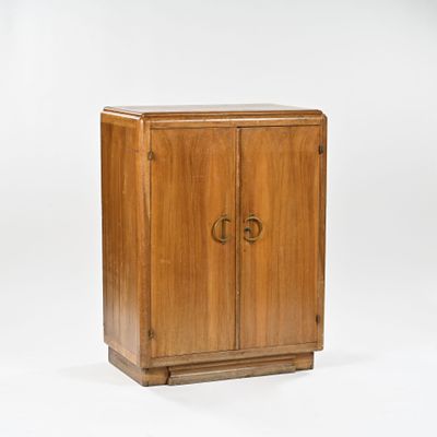 a wooden cabinet with two doors and a door handle