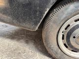 a close up of a car tire with a flat tire