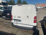 a white van that is parked in a parking lot