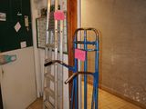 a hand truck that is sitting in the middle of a room