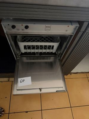 a dishwasher that is open on the floor