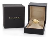 a black box with a gold ring inside of it