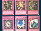 six cards of different colors and designs on a blue background