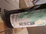 a bottle of wine sitting on top of a cardboard box