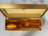 a bottle of champagne in a gold box on a table
