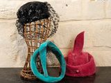 two hats that are sitting next to each other on a table