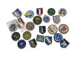 many different types of military badges on a white surface