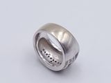 sterling silver ring with black dots on the inside of the band
