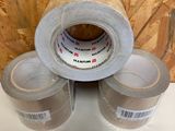 three rolls of tape sitting on top of each other on a table