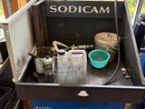 an image of a soda machine in a garage