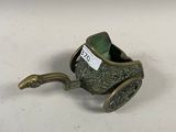 an image of a small metal object with a handle