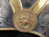 a close up of a helmet with a lion on it