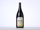 a bottle of wine sitting on top of a table