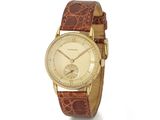 une image d'une montre-bracelet en or avec un bracelet en cuir marron