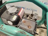 a close up of the engine of a lawn mower