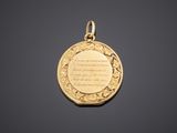 a gold locke with a poem written on it