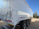 an image of a white trailer parked in a lot