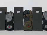 five pairs of gloves are lined up in a row next to each other