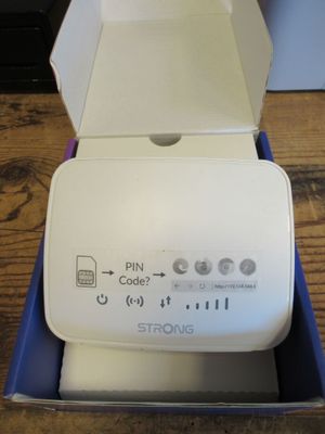 a box that has a phone in it on a table
