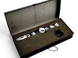a black box with a watch and a keychain in it