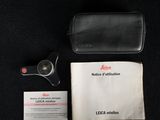 the contents of a black leather case and a black leather wallet