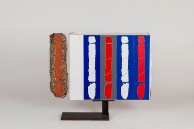 a red, white, and blue object on a stand