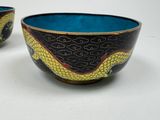 two bowls that are sitting on a white surface
