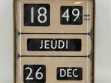 a clock that reads 18 49 and the date of the day