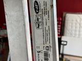 a close up of a metal door handle with a sticker on it