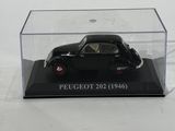 a close up of a small black car in a clear display case