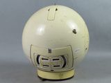 a white helmet with a yellow emblem on it