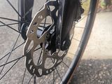 a close up of a bicycle wheel on the street
