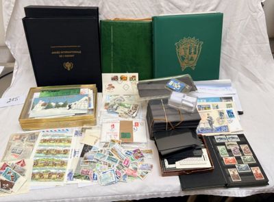 a table with a lot of stamps and books on it
