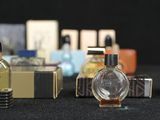 many different types of perfume bottles on a table