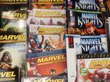 a lot of comic books that are on the table