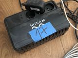 a black box with wires attached to it on the floor