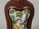 a small bottle with a picture of a child on it