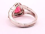 silver ring with pink stone and diamond accents on a white background