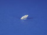 a single diamond on a blue surface